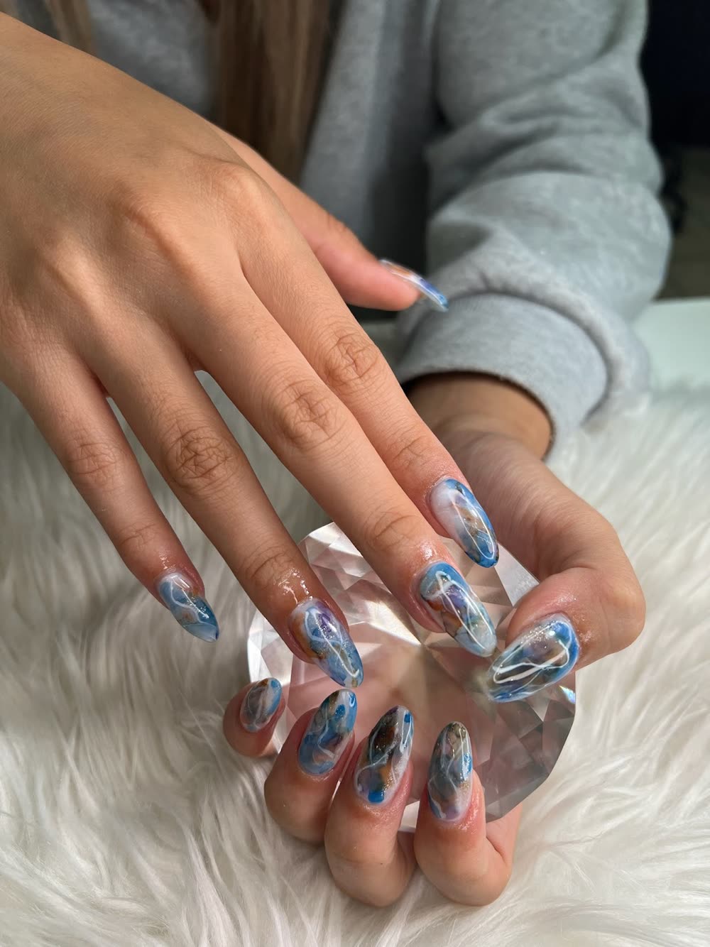 Blue and brown agate-marble almond nails