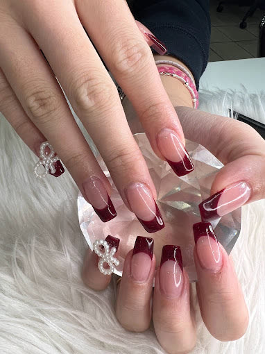 Burgundy French coffin nails with pearl bow accents