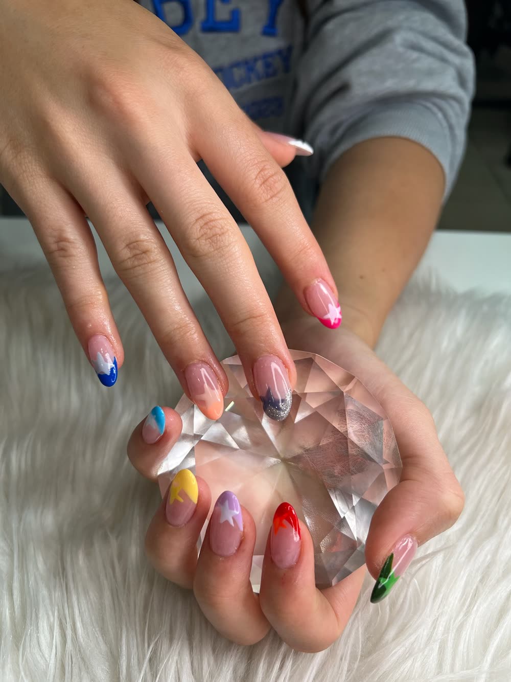 Pastel rainbow star French almond nails