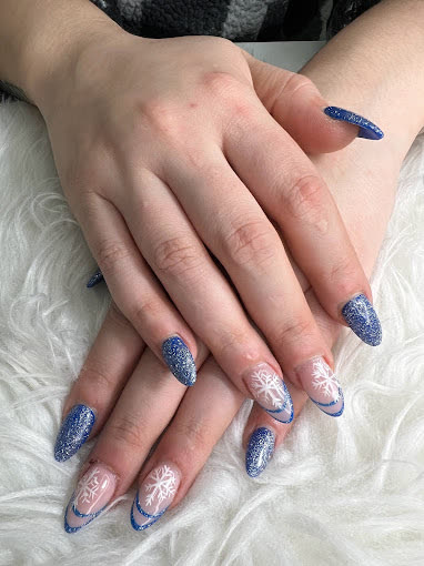 Blue glitter nails with white snowflakes